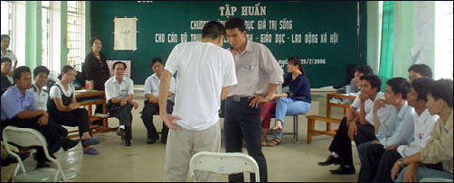 Participants acting out a skit on how to manage their relationships with their families